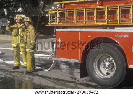 Firefighters working at apartment fire, Los Angeles, California