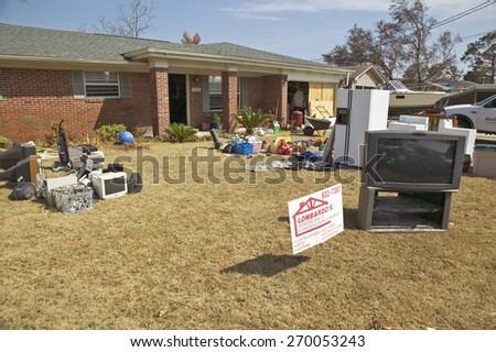 Debris in front of house heavily hit by Hurricane Ivan in Pensacola Florida