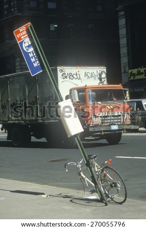 Vandalized bicycle and graffiti covered truck, South Bronx, New York