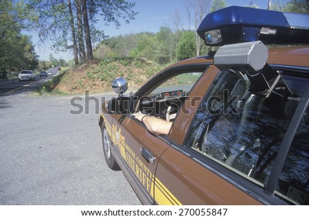 Sheriff sitting in car at speed trap, Greene County, Virginia