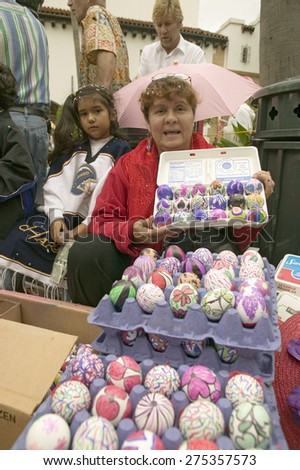 Mexican-American woman shows rainbow colored eggs at annual Old Spanish Days Fiesta held every August in Santa Barbara, California