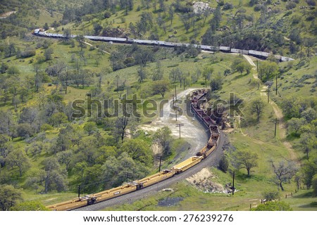 The Tehachapi Train Loop, Tehachapi California is the historic location of the Southern Pacific Railroad where freight trains gain 77 feet in elevation and show freight cars traveling in giant loop