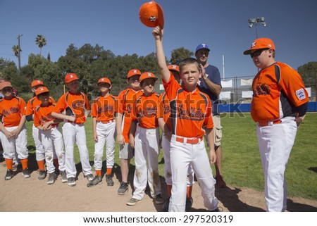 Oak View, California, USA, March 7, 2015, Ojai Valley Little League Field, youth Baseball, Spring, raise their caps when name is announced