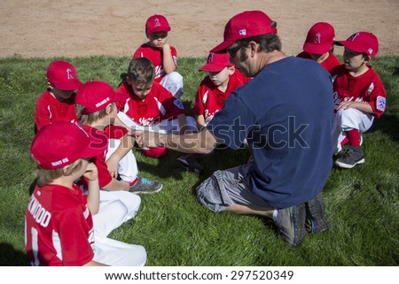 Oak View, California, USA, March 7, 2015, Ojai Valley Little League Field, youth Baseball, Spring, coach teaches Tee-Ball Division players