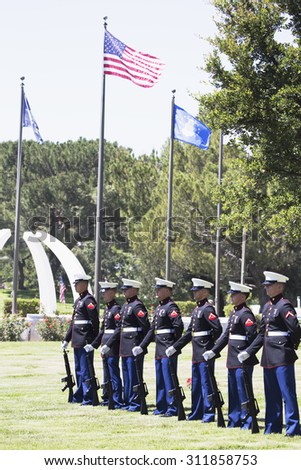 US Marines stand at attention at Memorial Service for fallen US Soldier, PFC Zach Suarez, \