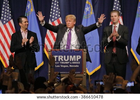 LAS VEGAS, NV - FEBRUARY 23, 2016: Donald Trump is flanked by sons Eric (Right) and Donald Jr. (Left) during Mr. Trump\'s victory speech after Nevada caucus, Las Vegas, NV at Treasure Island Casino and Hotel