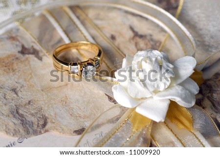 stock photo Wedding ring on a fancy wedding invitation
