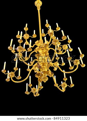 Golden antique chandelier isolated in black