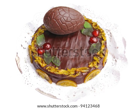 Chocolate and fruits cake, home made for Easter time with a chocolate Easter egg. Isolated in white