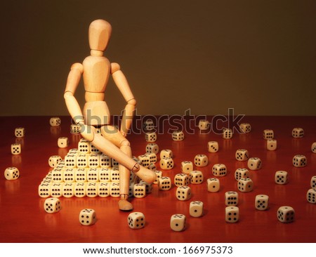 Doll and game dices symbolizing a project manager