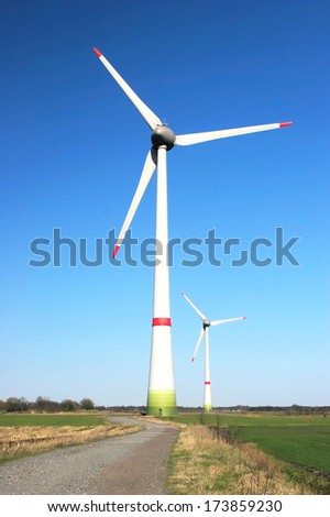 Two windmills on a cloudless sunny day