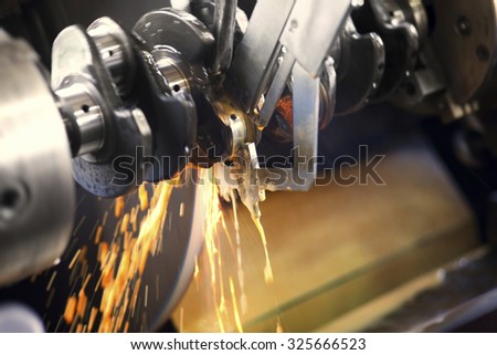 Closeup shot of working industrial machine. This machine is used for the treatment of automotive and marine / boat engines. Visible grain. Short depth of field and selective focus.