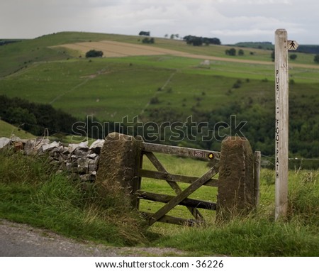 Finger post, public footpath, and gate.