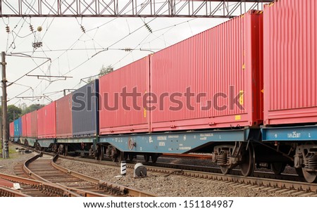 freight train transporting colored railway containers