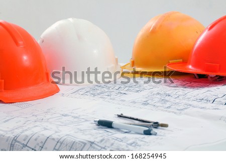 colored construction helmets floor plan background