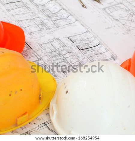 colored construction helmets floor plan background