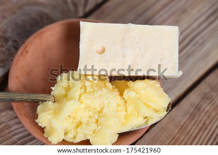 cheese and melted butter on a wooden table
