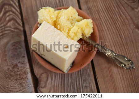 cheese and melted butter on a wooden table