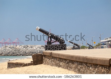 Colombo, Sri Lanka, March 24, 2014:vintage cannon  on background of the port city of Colombo.