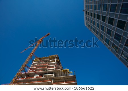 high-rise crane transfers the load on building high-rise building