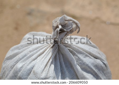 large white bag with building materials, sand, cement, waste