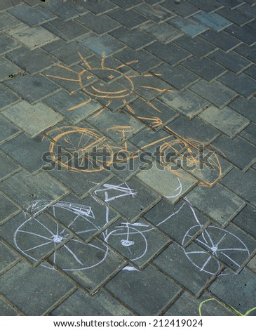 drawing with chalk on the sidewalk bicycle tile