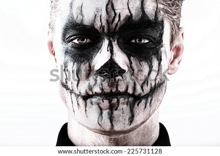 Portrait man with Halloween skull makeup. Halloween or horror theme