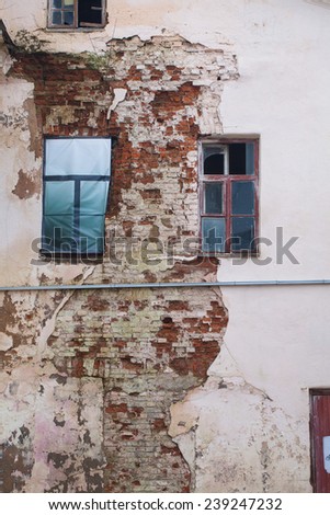 Cracked plaster wall old bricks. Imitation windows drawing on canvas