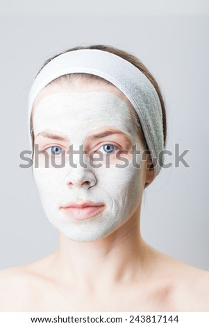 Nourishing rejuvenating cleansing mask on her face.