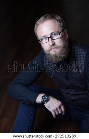 portrait of a bearded man. Bearded businessman with glasses and bow tie