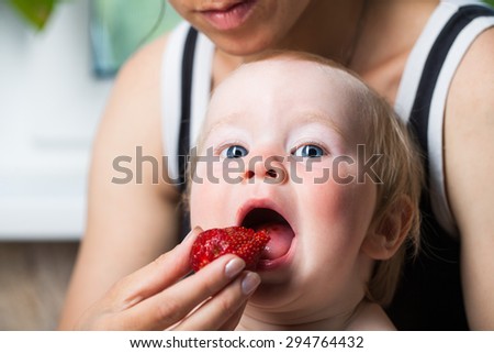 feeding baby strawberries
