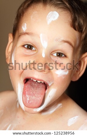 Boy with chicken pox rash with tongue