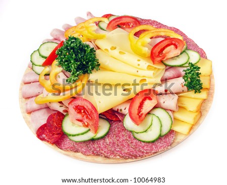 Cold food - salami and fresh vegetables served on plate