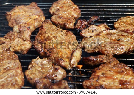 outdoor grilled pig meat on grill