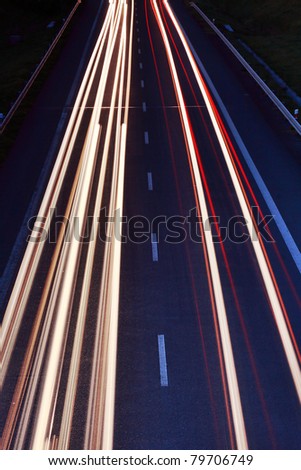 Highway at night with cars lights