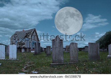 An old graveyard and dilapidated building in the light of the full moon