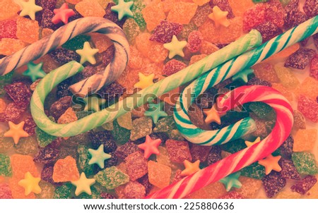 Fruit candy with caramel candy in the shape of stars and striped