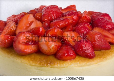 cheese cake / Cheese cake topped with glazed strawberries.