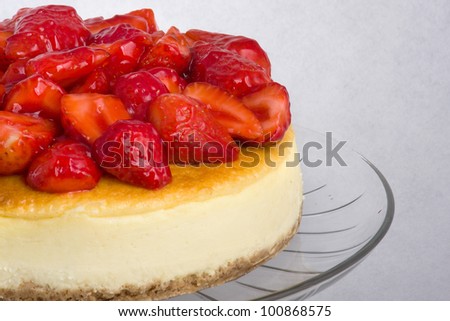 cheese cake / cheese cake topped with glazed strawberries.