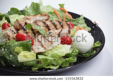 chicken salad serve on a black plate. This image was shot with a canon mark II. / Chicken salad