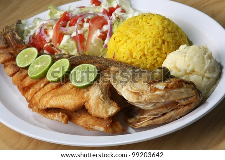 Fried Fish/ Fried Fish served with side salad, rice, and mash potatoes.