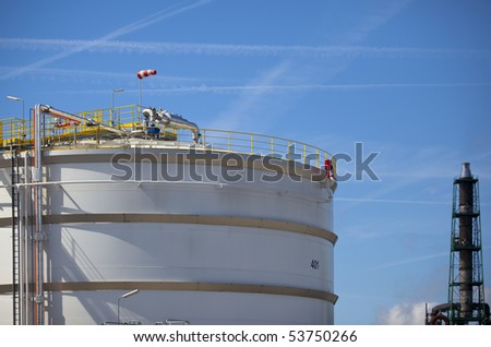 white oil tanks in the harbour of rotterdam