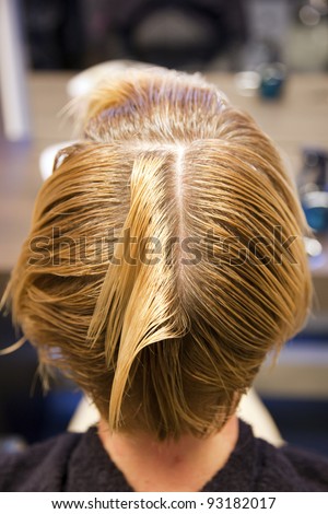 Closeup view during hair dyeing treatment ...
