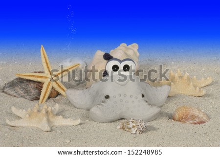 starfish with funny face on ocean floor