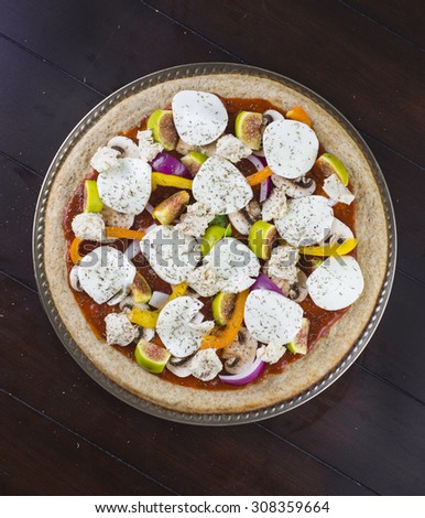 Delicious veggie pizza with fresh toppings and goat cheese