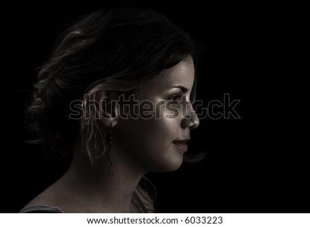 Woman profile on dark background