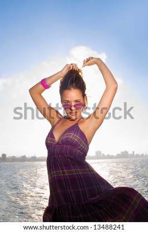 Portrait of fashion female in summer clothes with sunglasses