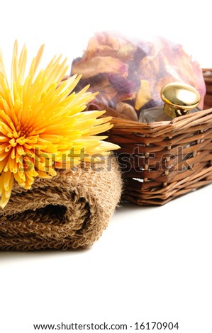 Basket with natural spa elements and chrysanthemum â?? isolated on white