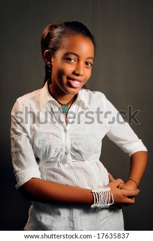 stock photo Portrait of young cheerful african teen girl posing