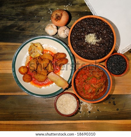 Assorted typical cuban dishes over wooded table